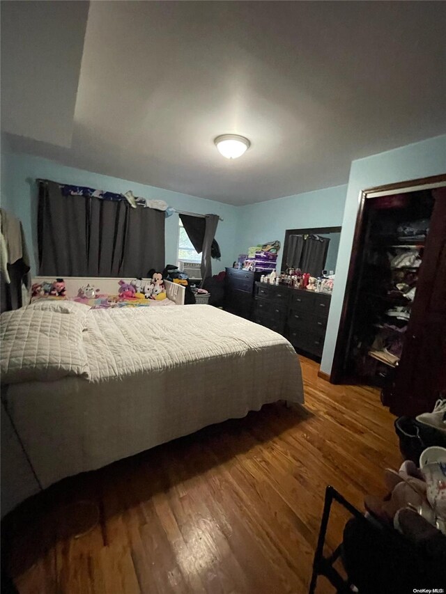 bedroom featuring hardwood / wood-style floors