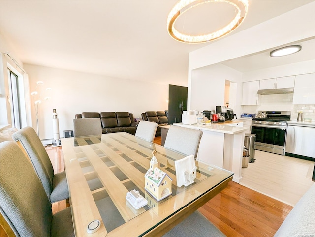 dining room with light wood-type flooring