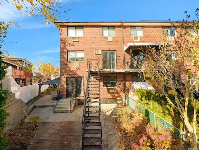 back of property featuring a patio