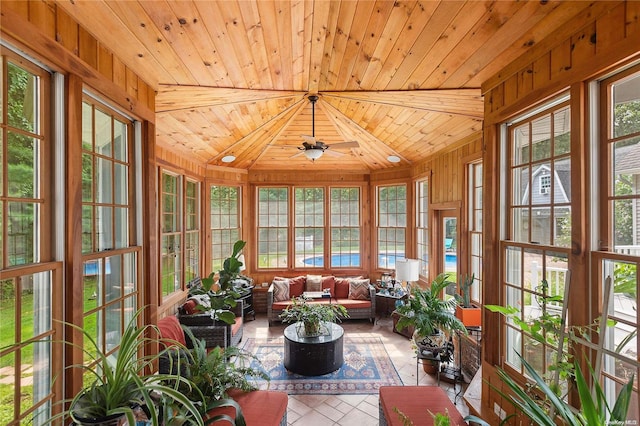 unfurnished sunroom with ceiling fan and wooden ceiling