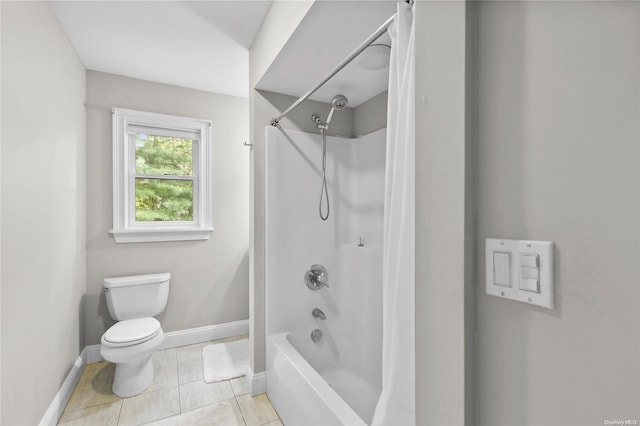 bathroom with toilet, tile patterned flooring, and washtub / shower combination