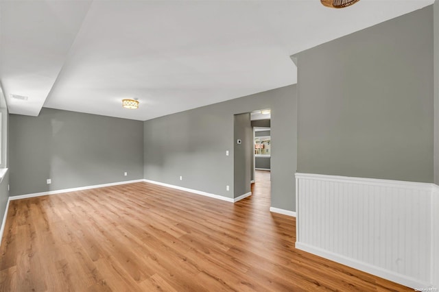 unfurnished room with light wood-type flooring