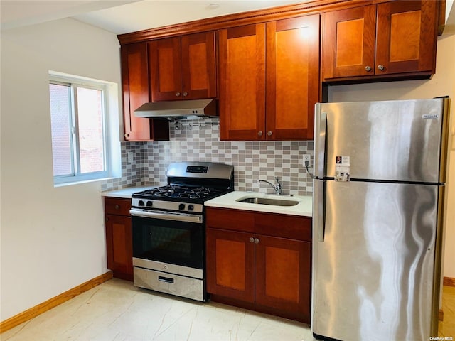 kitchen with stainless steel appliances, tasteful backsplash, and sink