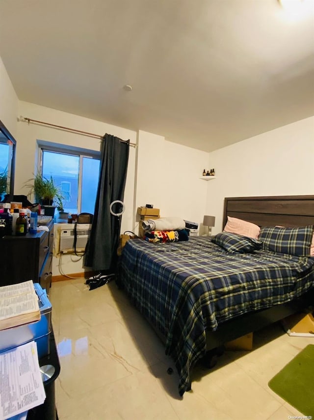 bedroom featuring a wall unit AC