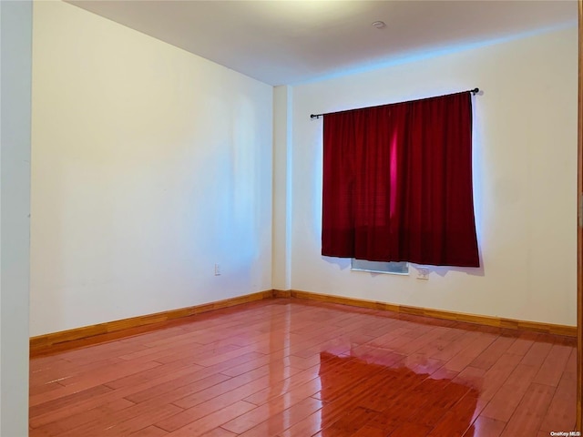 empty room with light hardwood / wood-style floors