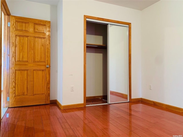 unfurnished bedroom featuring wood-type flooring