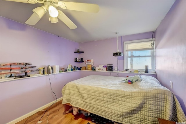 bedroom featuring ceiling fan and light hardwood / wood-style floors