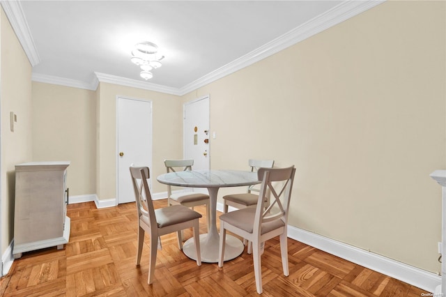 dining area with crown molding and light parquet floors