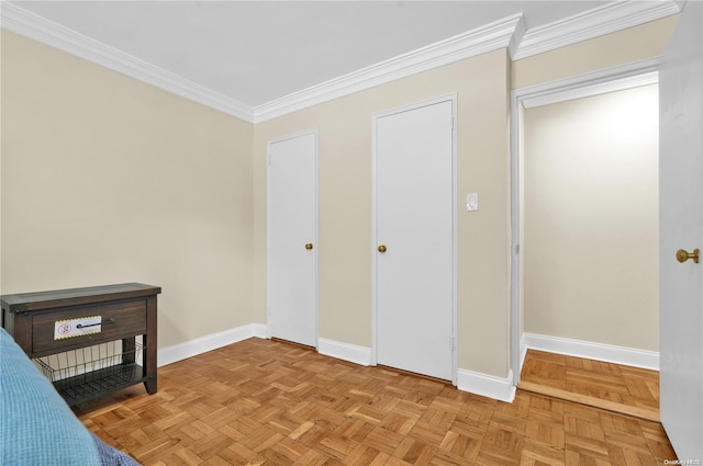 unfurnished bedroom featuring light parquet flooring and ornamental molding