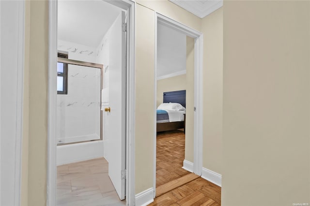 hallway with light parquet floors and crown molding