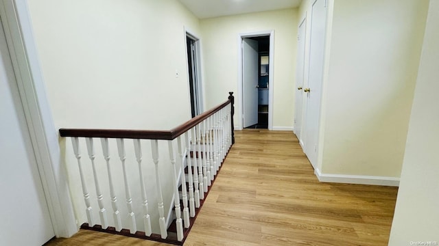 2041 New Hyde Park Rd, New Hyde Park, NY 11040 - hall with an upstairs landing, light wood-style floors, and baseboards