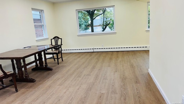 2041 New Hyde Park Rd, New Hyde Park, NY 11040 - home office with wood finished floors, baseboards, and baseboard heating