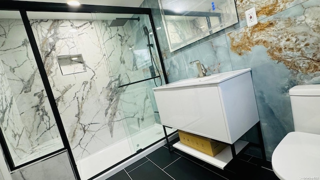 2041 New Hyde Park Rd, New Hyde Park, NY 11040 - bathroom with toilet, vanity, a marble finish shower, and tile walls