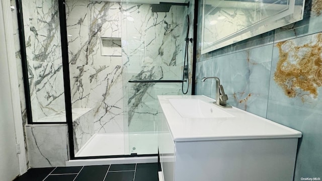 bathroom featuring vanity, tile walls, and walk in shower