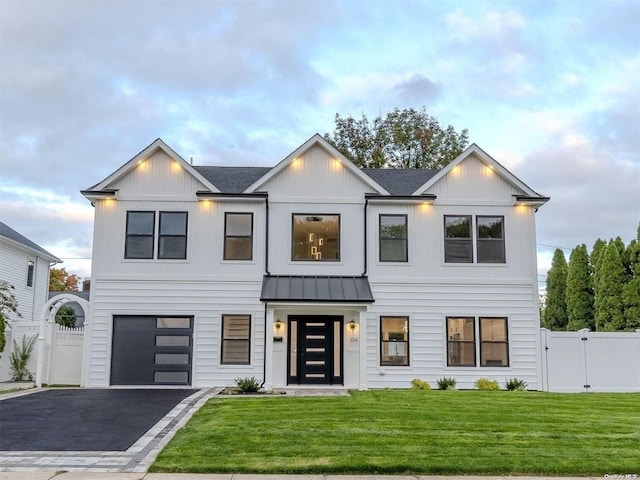 modern farmhouse with a garage and a front yard