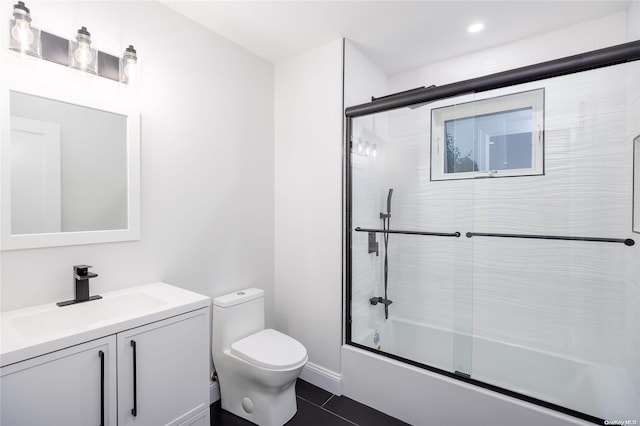 full bathroom featuring tile patterned flooring, vanity, toilet, and enclosed tub / shower combo