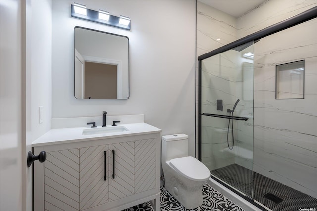 bathroom with vanity, an enclosed shower, and toilet