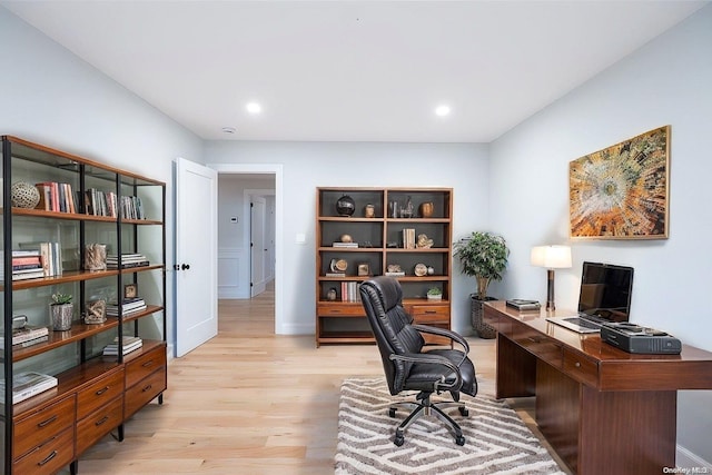 office area with light hardwood / wood-style floors