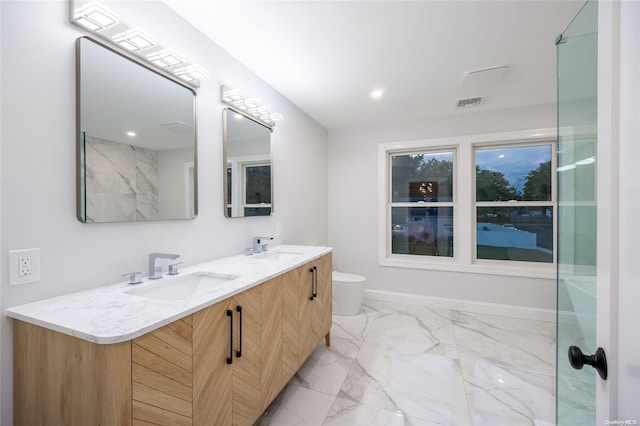 bathroom with a shower, vanity, and toilet