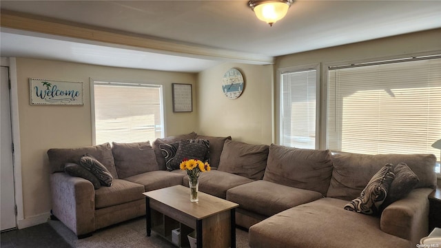 living room with beam ceiling