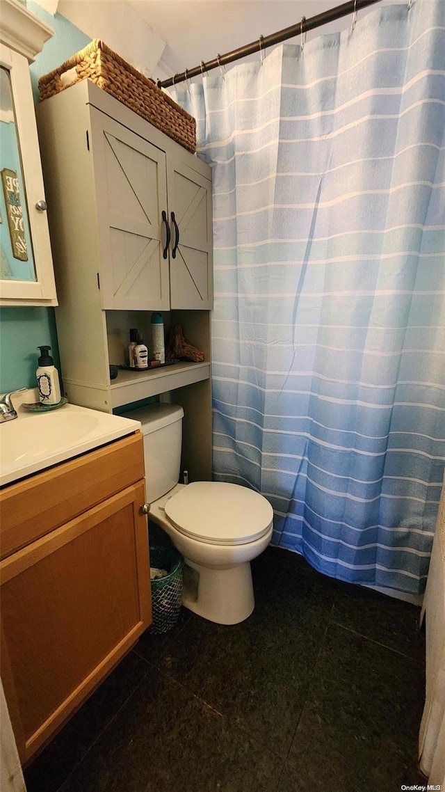 bathroom featuring vanity and toilet