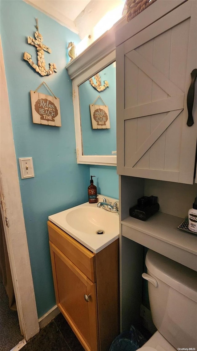 bathroom with vanity and toilet