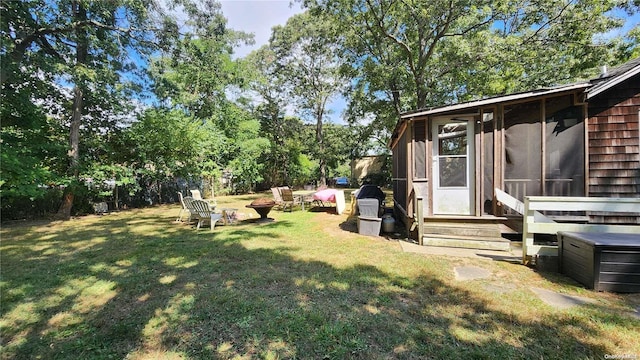 view of yard featuring a sunroom