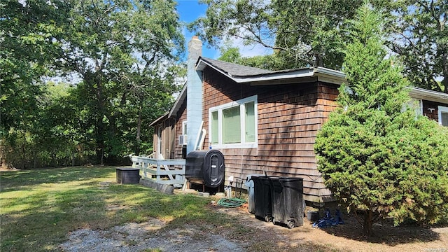 view of property exterior featuring a lawn