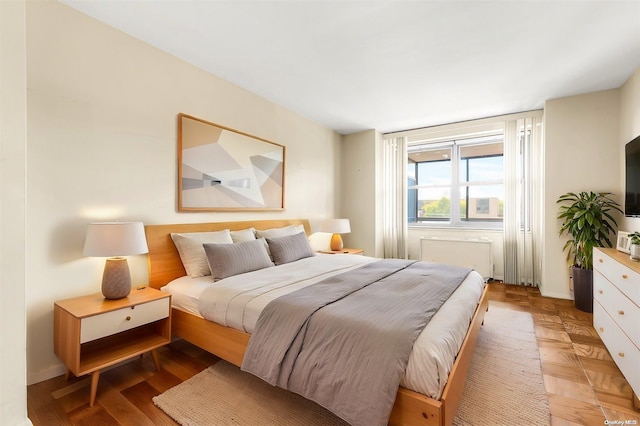 bedroom featuring light parquet flooring