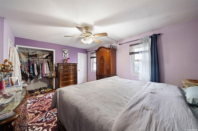 bedroom with ceiling fan and a closet