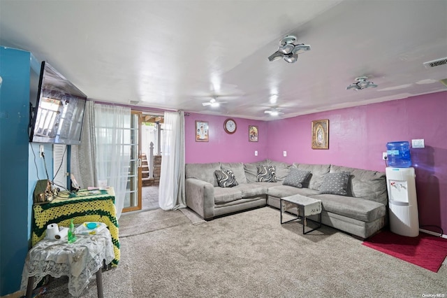 living room with carpet flooring and ceiling fan