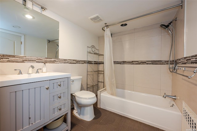 full bathroom featuring radiator, vanity, shower / bath combo with shower curtain, tile walls, and toilet