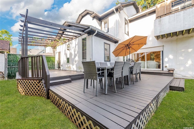 wooden deck featuring a pergola and a lawn