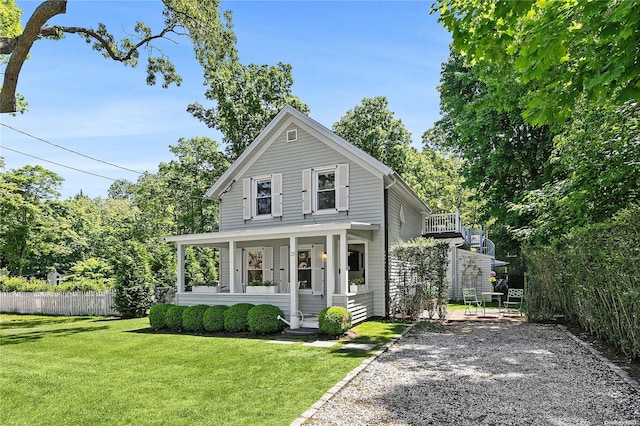 view of front of house featuring a porch and a front yard