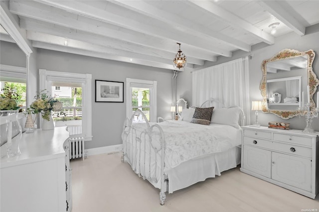 bedroom featuring radiator heating unit, light wood-type flooring, multiple windows, and beam ceiling