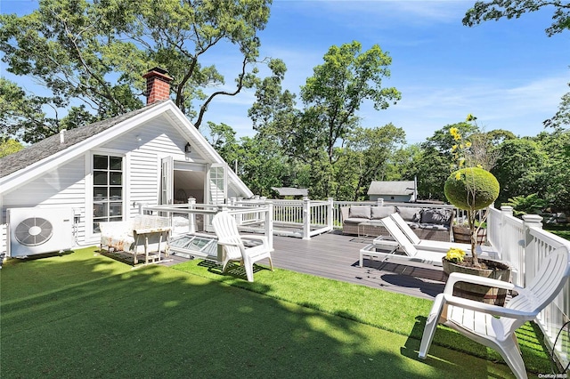 back of property featuring a lawn, an outdoor living space, a deck, and ac unit