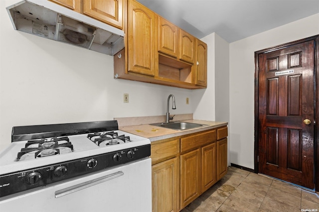 kitchen featuring sink and white gas range oven