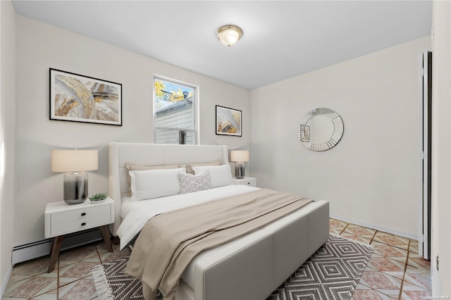 tiled bedroom featuring a baseboard heating unit