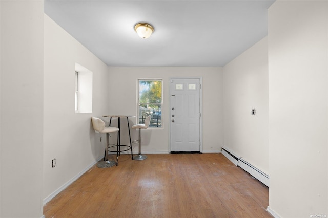 entryway featuring a baseboard radiator and light wood-type flooring