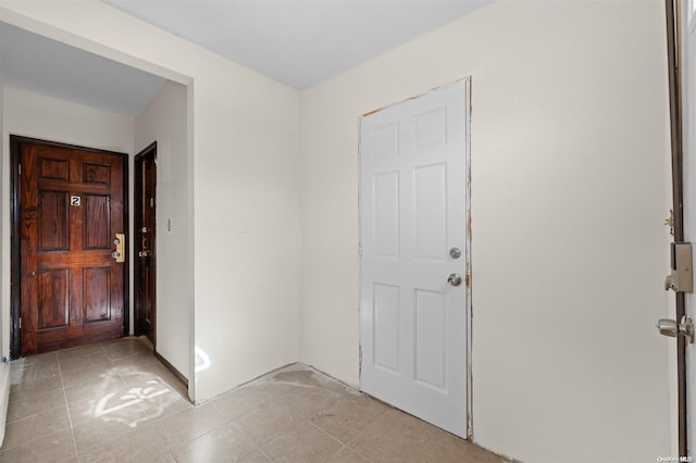 entrance foyer featuring light tile patterned flooring