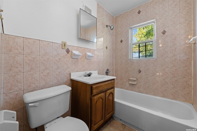 full bathroom with tile patterned flooring, vanity, tile walls, and toilet