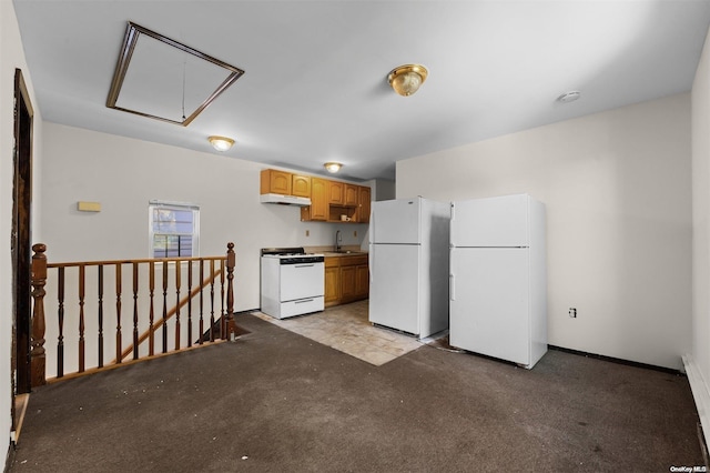 kitchen featuring light carpet, sink, and white appliances