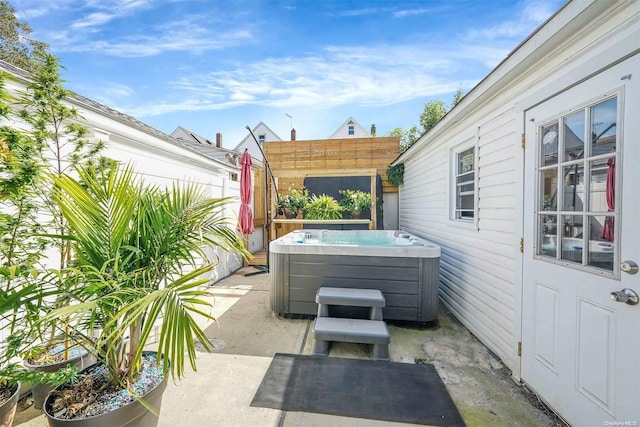 view of patio / terrace featuring a hot tub