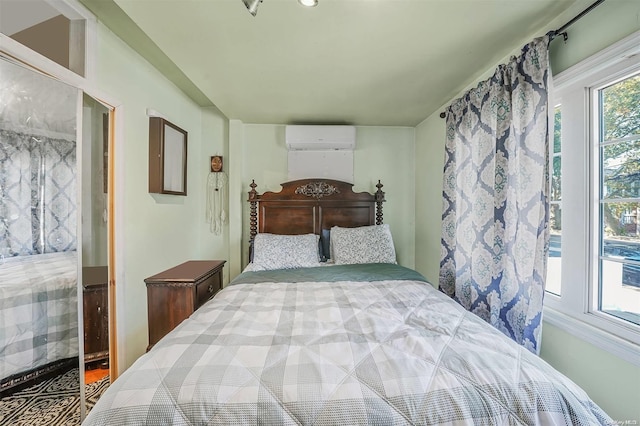 bedroom featuring a wall mounted air conditioner