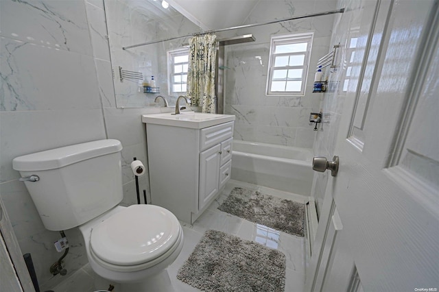 full bathroom featuring shower / tub combo, vanity, toilet, and plenty of natural light