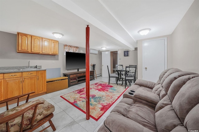 tiled living room featuring a wall mounted air conditioner, baseboard heating, and sink