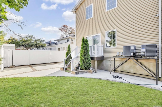 view of yard featuring a patio and cooling unit