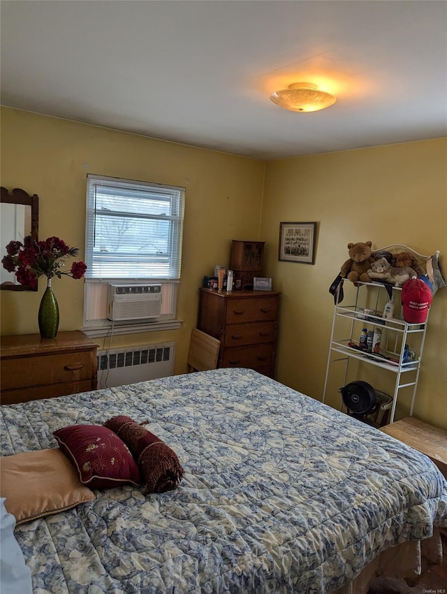 bedroom featuring cooling unit and radiator