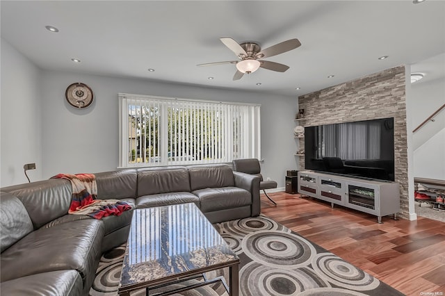 living room with hardwood / wood-style floors and ceiling fan