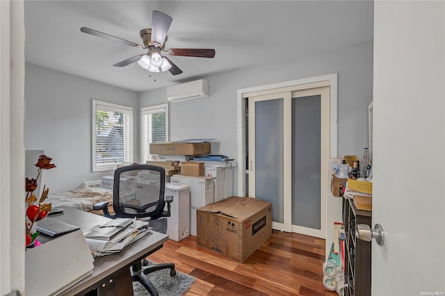 office area with a wall mounted AC, ceiling fan, and hardwood / wood-style floors